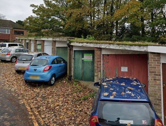 Land, in Two Garages, £8,000