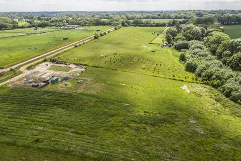 Land, in Upper Bourne End Lane, £10,000