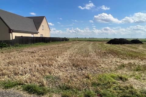 Land, in Whittlesey Road, £135,000