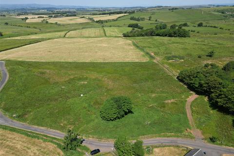 Land, in Plots, £125,000