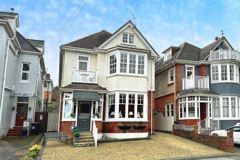 Land, in Studland Road, £1,000,000