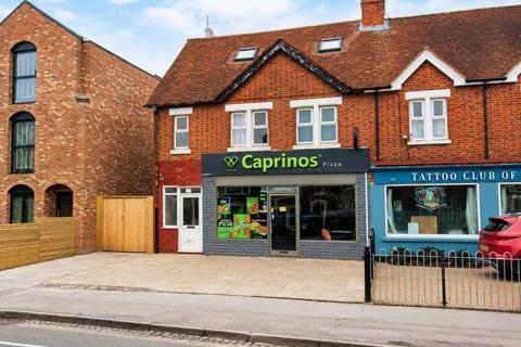 Land, in Cowley Road, £700,000