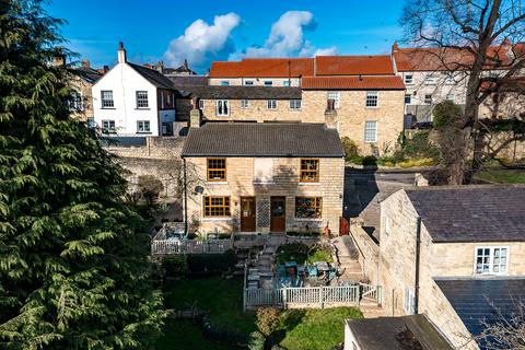Land, in High Street, £660,000