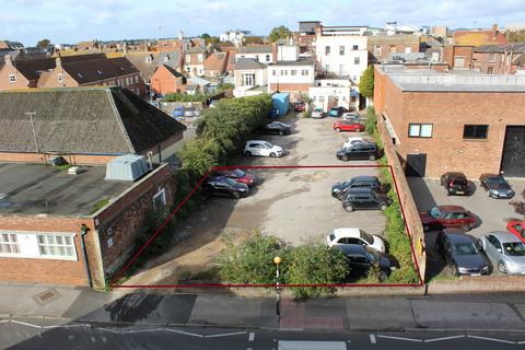 Land, in High Street, £595,000