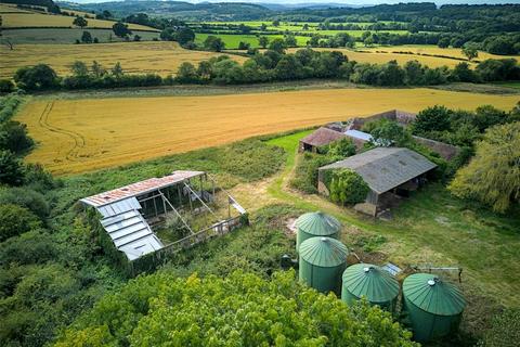 Land, in Wyke Farm Barns, £800,000