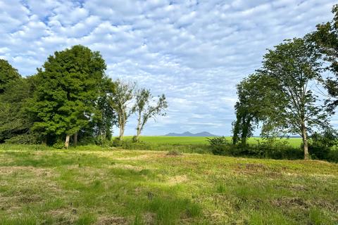 Land, in Rutherford Farm, £85,000