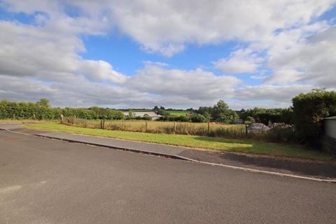 Land, in Maes Cawnen, £65,000