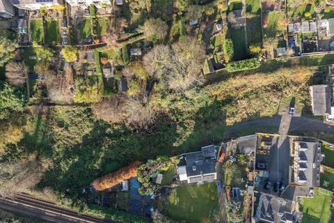 Land, in Belmont, £370,000