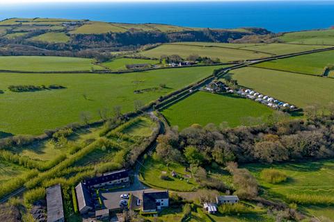 12 bed property, in Coastal Wood Holiday Cottages, £795,000