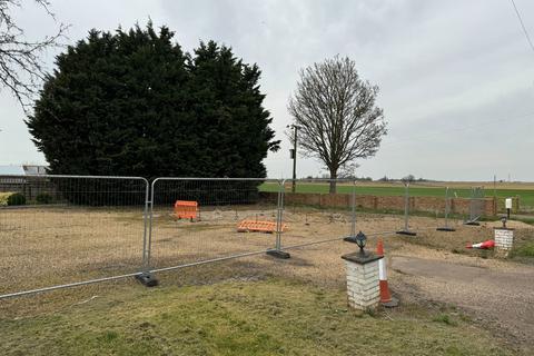 Land, in March Road, £125,000