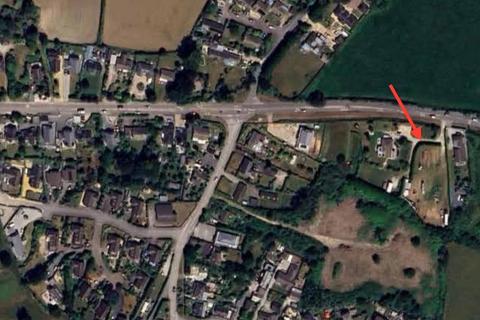 Land, in Helston Road, £500,000