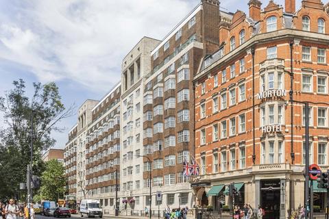 Land, in Woburn Place, £225,000