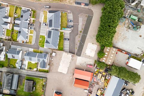 Land, in Plots B + E, £120,000