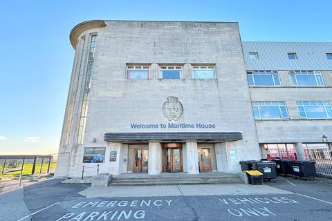 Land, in Maritime House, £65,000