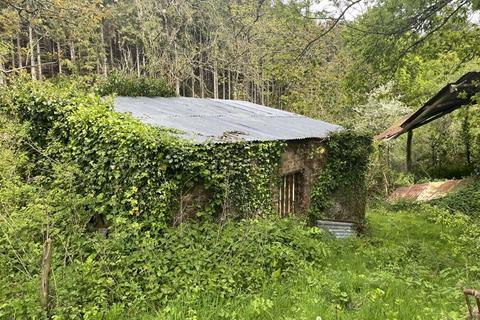 Land, in Bolsters Wood, £120,000