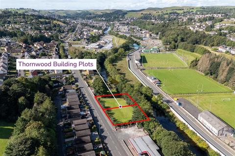 Land, in Building Plots, £85,000