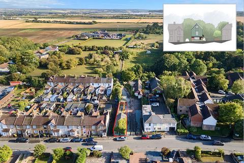Land, in 93 High Road, £220,000