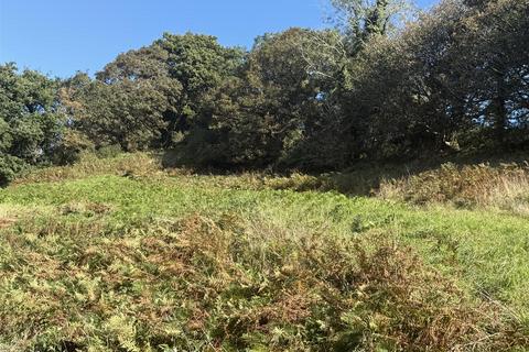 Land, in Bodmin Road, £200,000