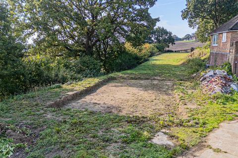 Land, in Woodland Way, £240,000