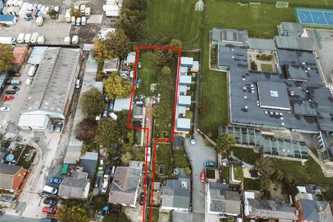 Land, in Stamford Road, £300,000