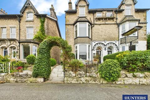 Land, in Milnthorpe Road, £475,000