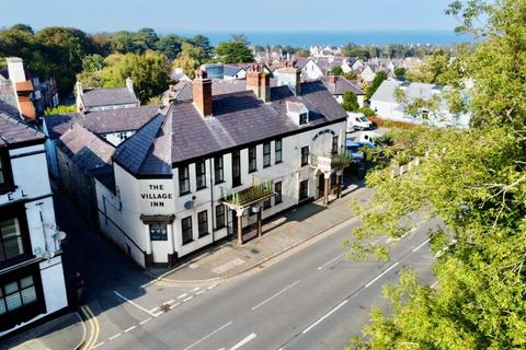 11 bed property, in Village Inn, £200,000