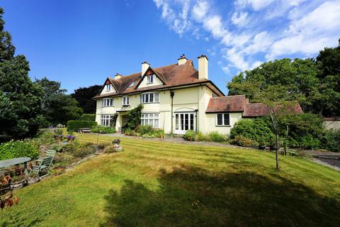 9 bed property, in A fine Arts and Crafts country house set in almost 3 acres in this sought after rural Hamlet, £1,495,000