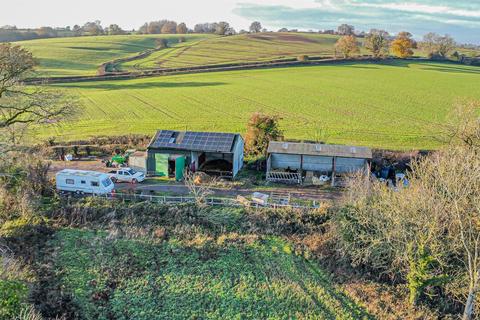 Land, in Marston Lane, £460,000