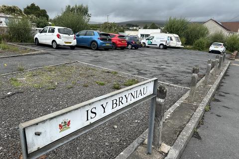 Land, in Car Park, £60,000