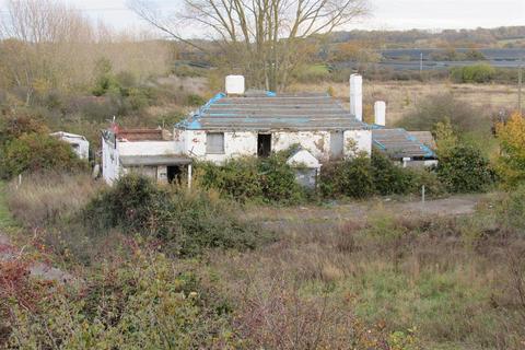 Land, in Owls Hatch Road, £250,000