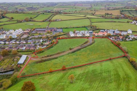 Land, in Cheriton Fitzpaine, £250,000