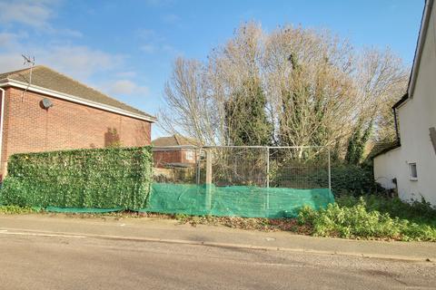 Land, in High Street, £95,000