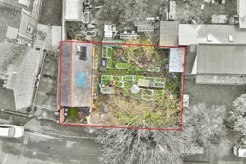 Land, in Park Road, £100,000