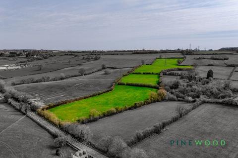 Land, in Low Road, £210,000