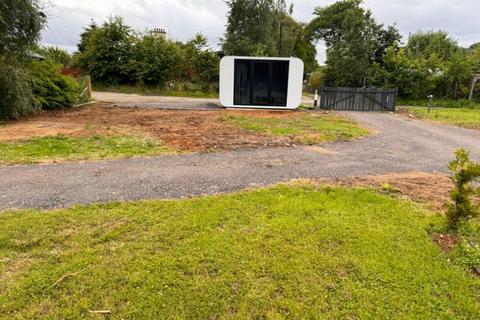 Land, in Black Water Plot With Pod, £16,000