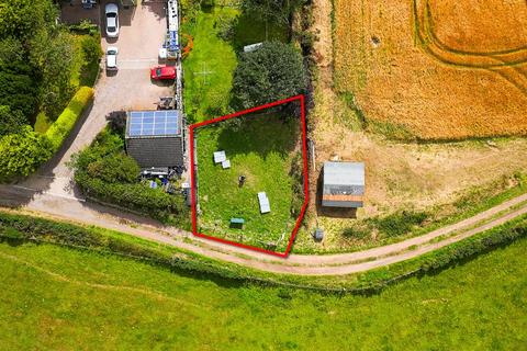 Land, in Site At Little Dens, £3,000