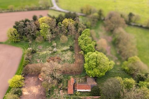 Land, in Ellingham Road, £300,000