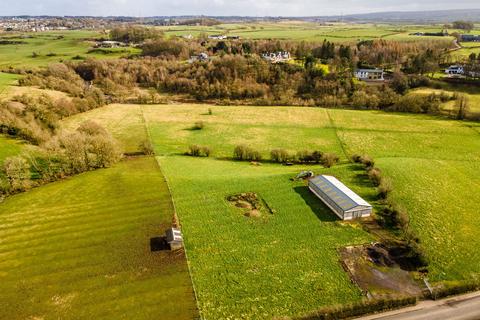 Land, in Eaglesham Road, £600,000