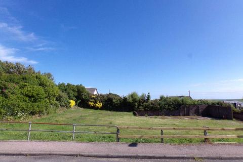 Land, in Muneroy, £55,000