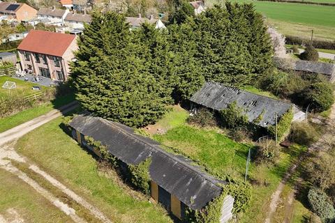 Land, in High Street, £500,000