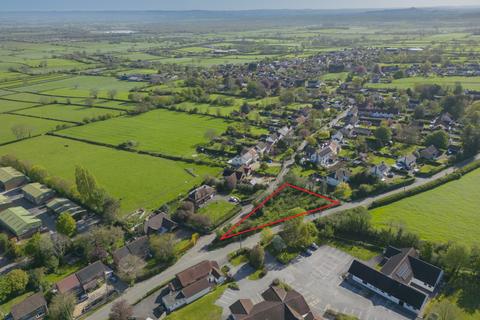 Land, in Woolavington Road, £225,000