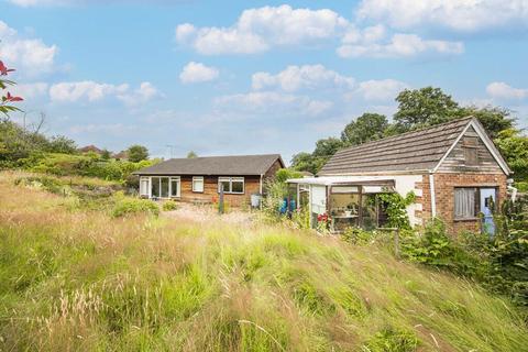 Land, in Pinewood Road, £750,000