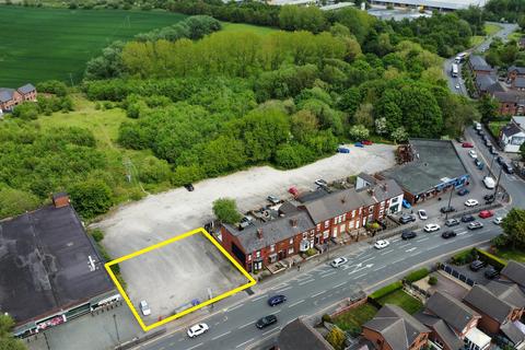 Land, in Wigan Road, £200,000