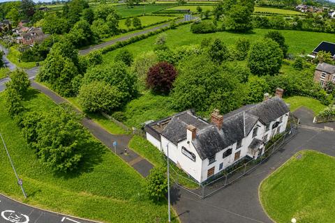 Land, in Four Crosses, £750,000