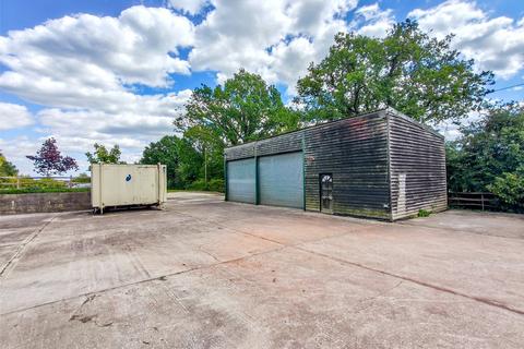 Land, in Burnt House Lane, £750,000