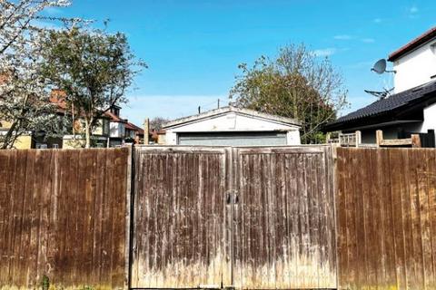 Studio, in Land To The Rear Of, £30,000