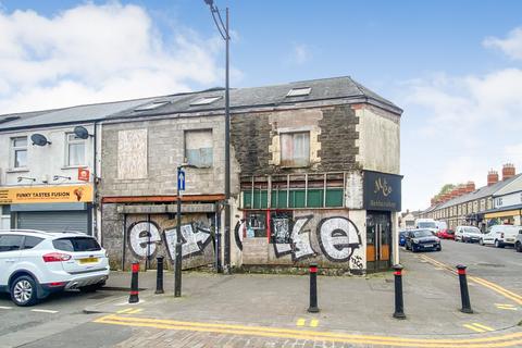 Land, in 111-112 Clifton Street, £295,000