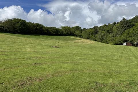 Land, in Bridford, £60,000