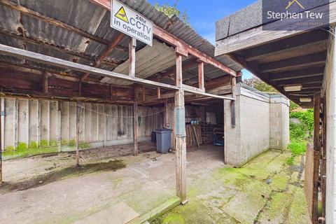 Land, in 126 Midgeland Road, £40,000