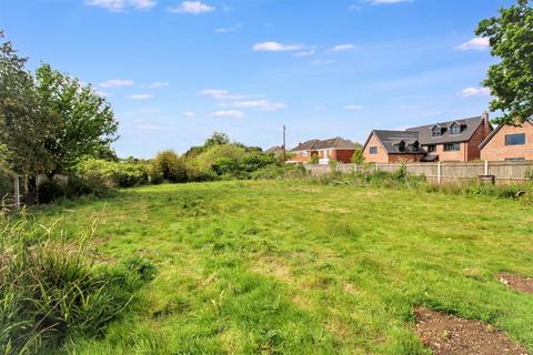 Land, in Great Plumstead, £150,000